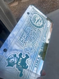 Image 1 of CHROME & LIGHT BLUE FELIX CADILLAC ICONIC LICENSE PLATE 