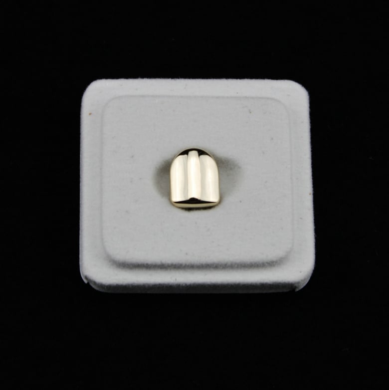 Image of Single gold tooth clip