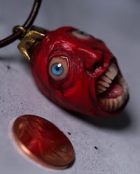 Image 2 of Berserk Egg of the King bleeding eyes pendant, leather cord, brass hardware, OOAK,