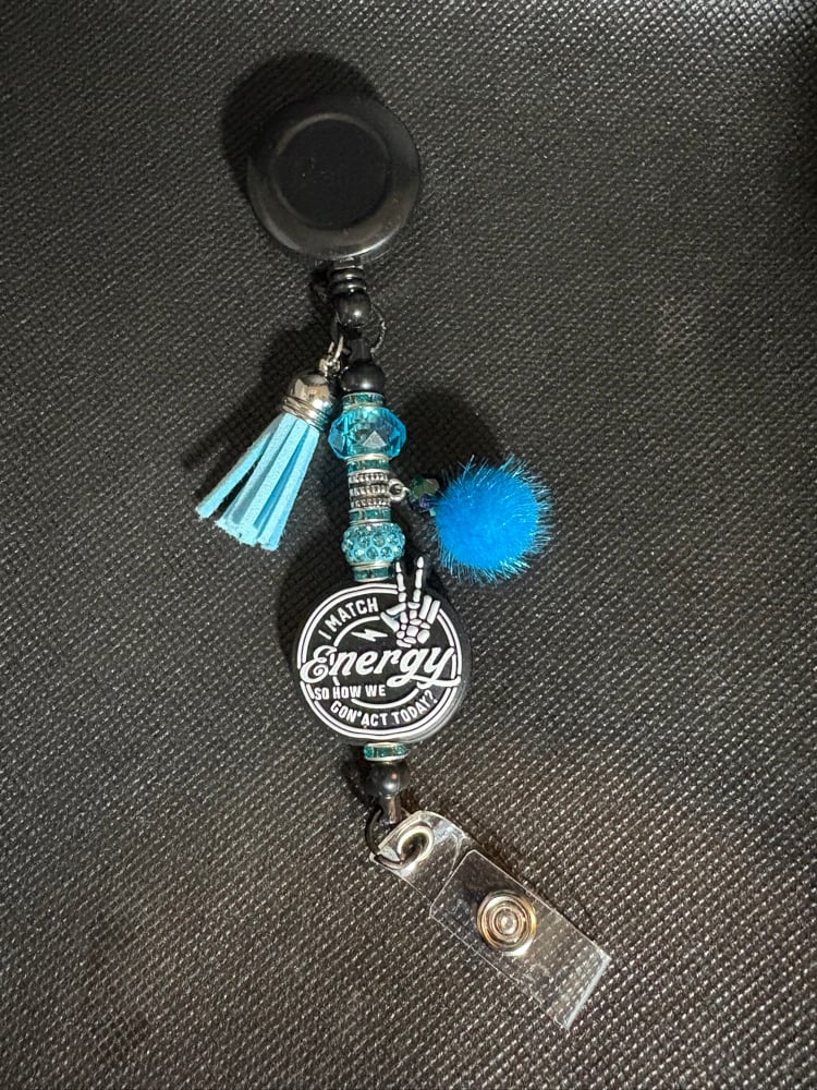 Image of Black and Blue I match energy  Badge Reel with Tassel