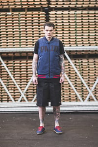 Image of PAID sleeveless varsity