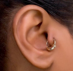 TRAGUS PIERCING SERVICES