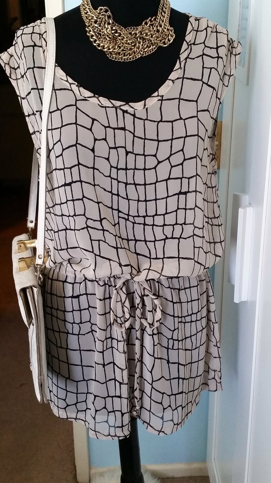 Image of Sheer Nude w/ graphic lines tunic top
