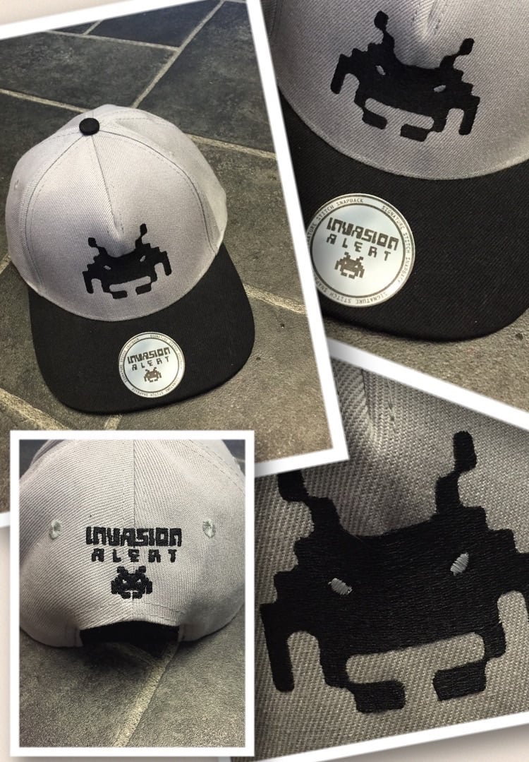 Image of INVASION SNAPBAK (black on grey)