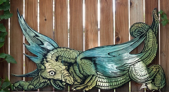 Image of Durer Dragon. Hand carved/painted Relief.