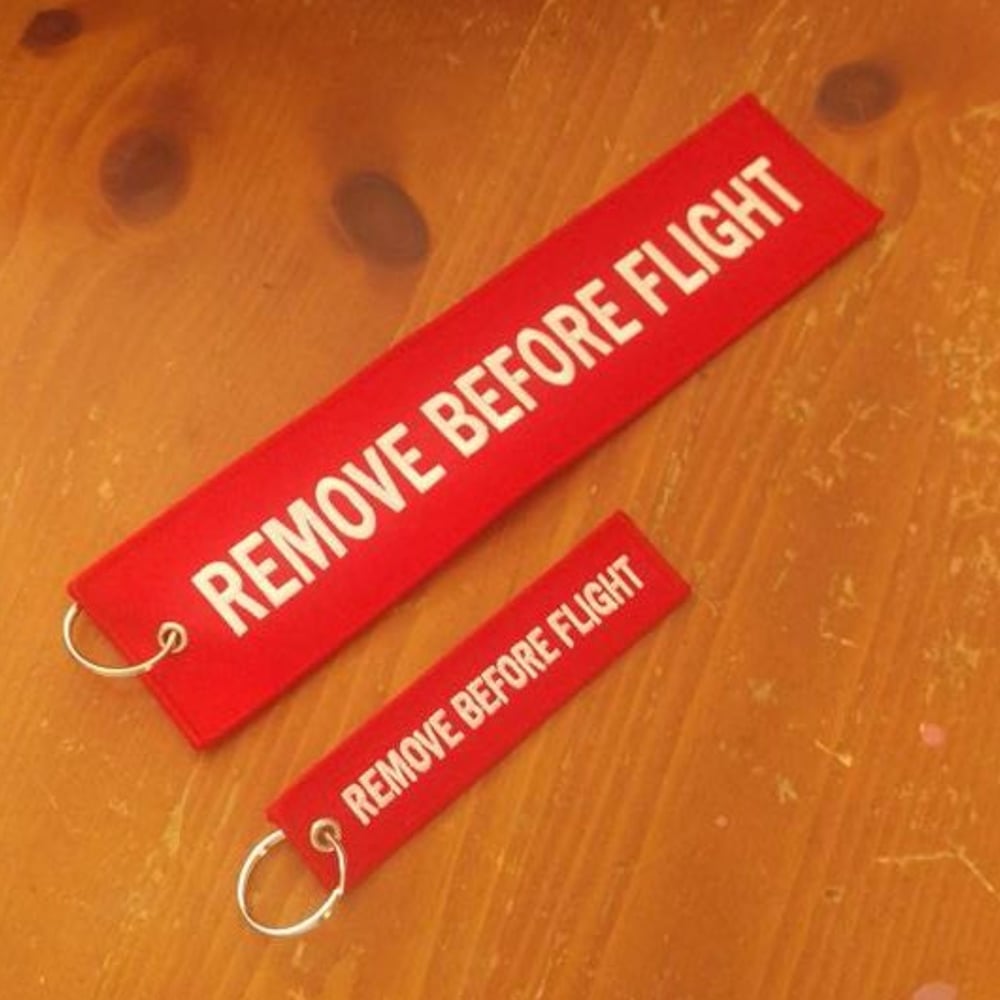 Image of Giant Remove Before Flight Tag