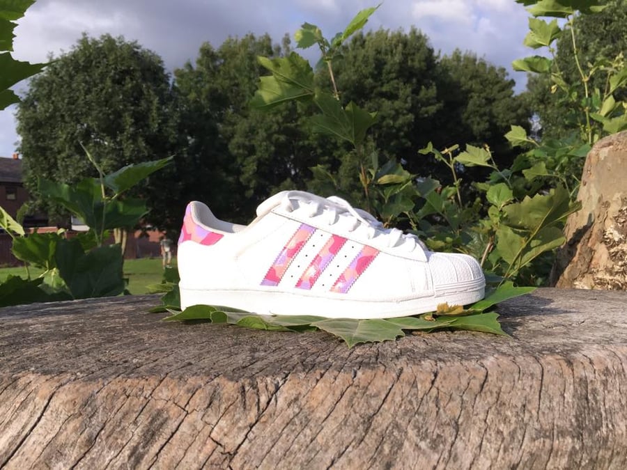 Image of White Adidas with 3 shade pink camo over the stripes & heel