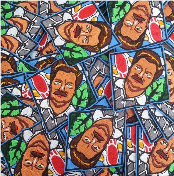 Image of ron swanson iron on patch. 