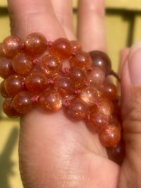 Image 4 of Sunstone Mala with Fire Quartz Guru Bead, Oligoclaise Sunstone 108 Bead Hand Knotted Gemstone Mala