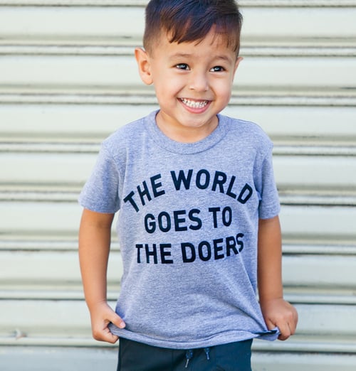 Image of The World Goes to the Doers Kids Tee
