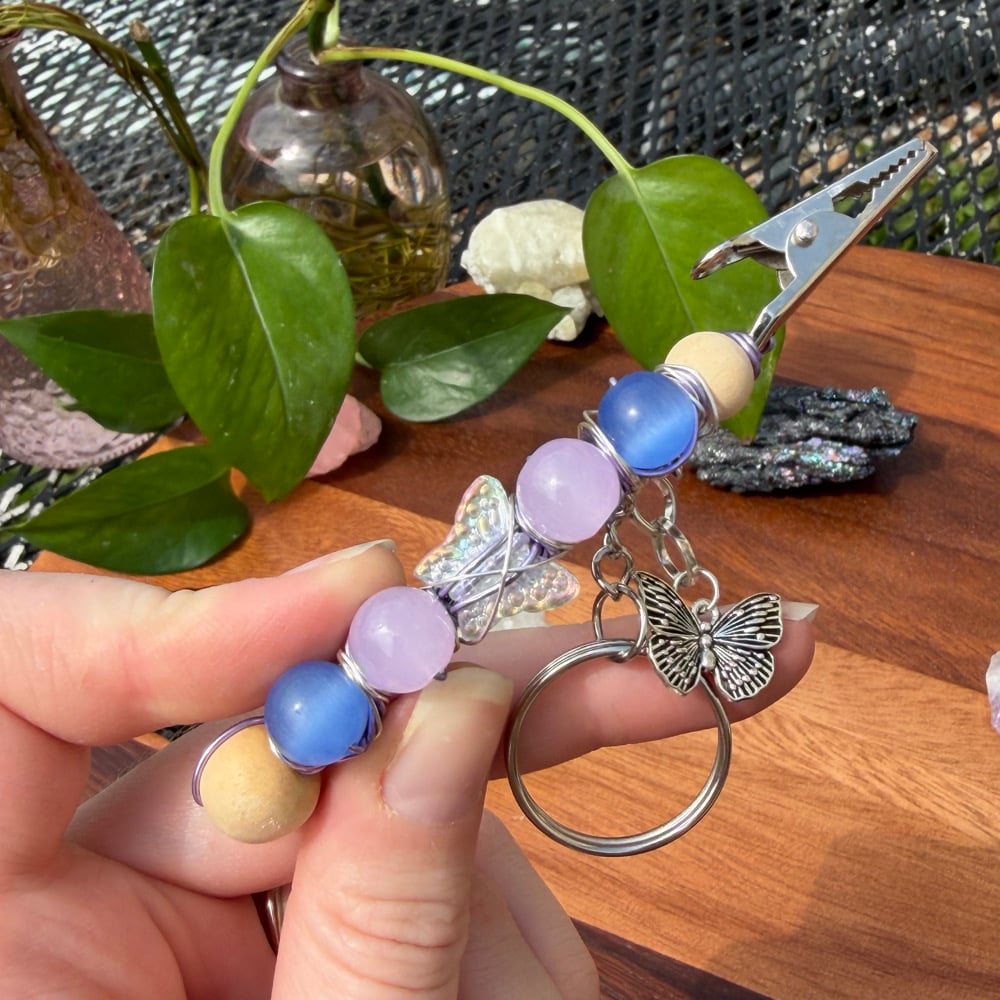 Image of indigo monarch clip keychain