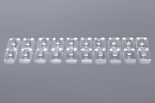 Image of silver pendant with letters