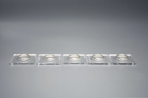 Image of silver ring for children with inscription in Latin