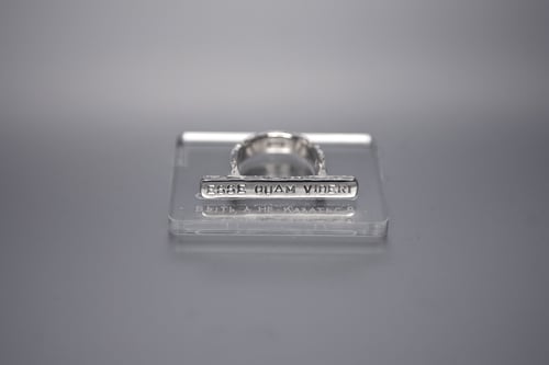 Image of silver plain ring with inscription in Latin