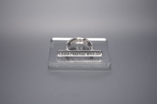 Image of silver plain ring with inscription in Latin