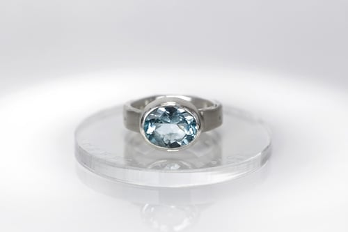 Image of sterling silver ring with blue topaz