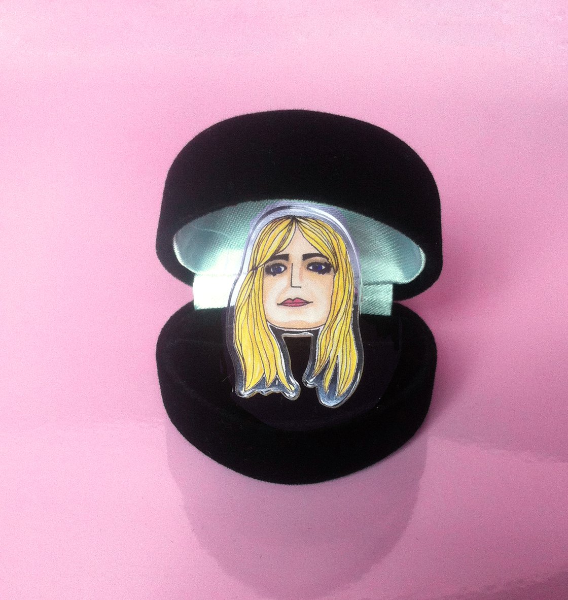 Image of Kim Gordon Sonic Youth acrylic plastic adjustable ring sold in a black heart shaped box.