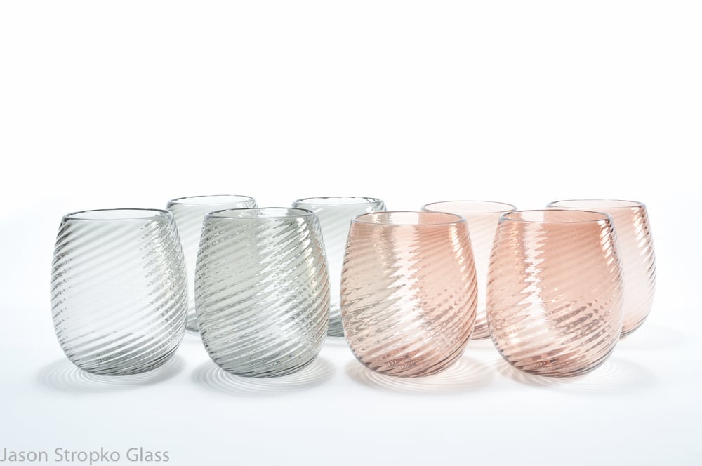 Image of 8 drinking glasses (red and white wine, juice, water or beer)
