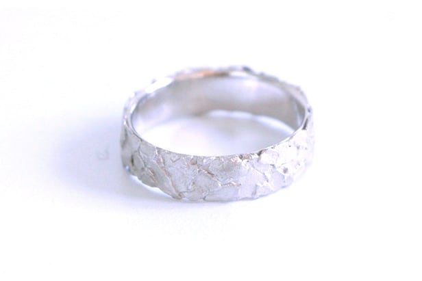 Image of Dans la roche, Wedding rings set in rose and white gold with diamond
