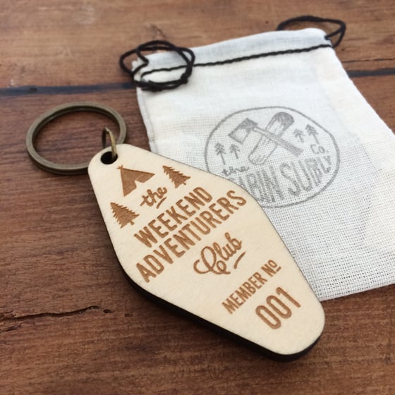 Image of birch ply wooden laser etched adventurers club key fob