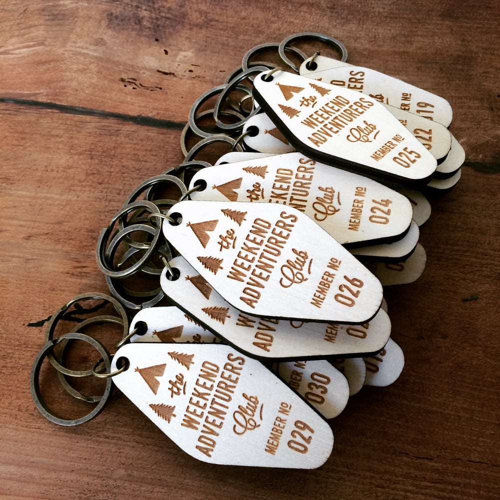 Image of birch ply wooden laser etched adventurers club key fob