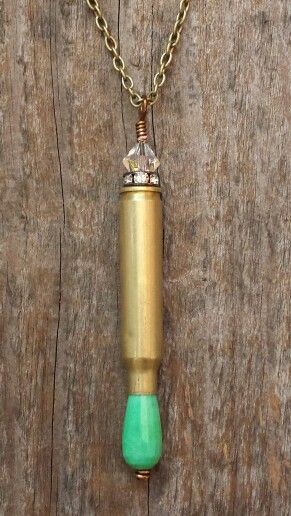 Image of .223 caliber rifle shell with moss green opal