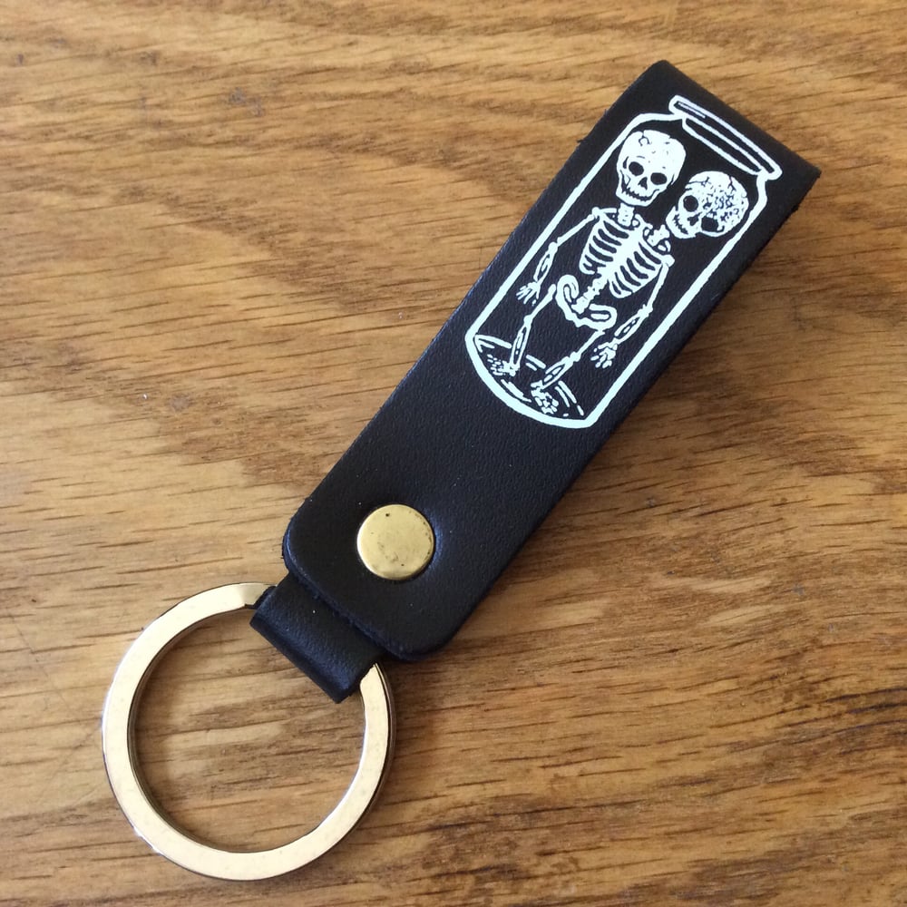 Image of Cabinet of Curiosities leather keyring, White