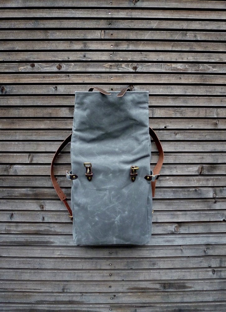 Image of Waxed canvas backpack with roll to close top and leather shoulder straps