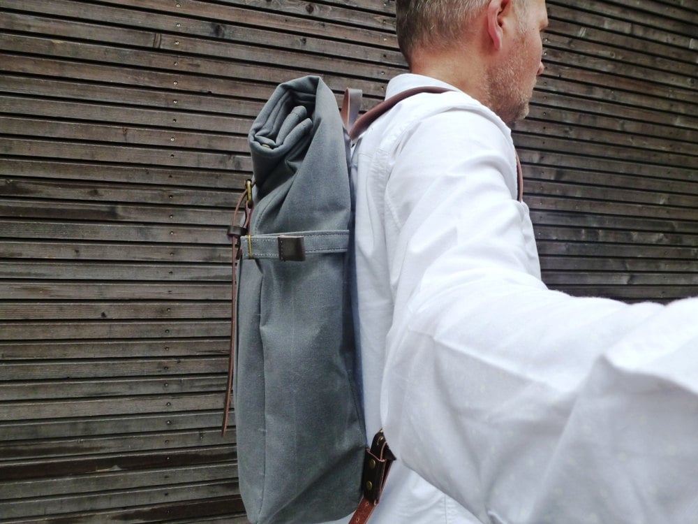 Image of Waxed canvas backpack with roll to close top and leather shoulder straps