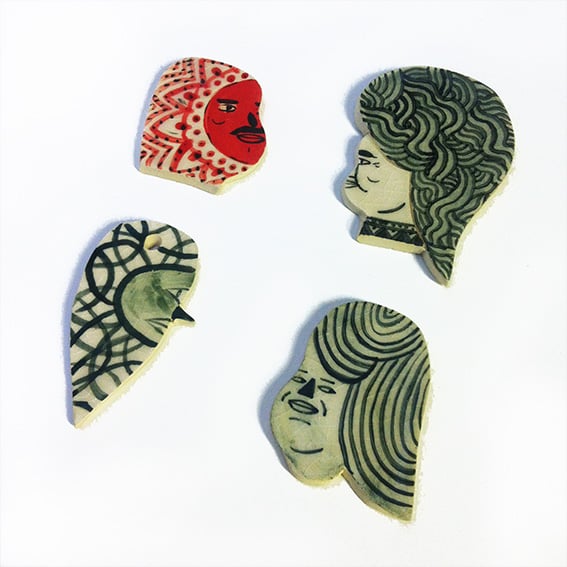 Image of Medium Sized Ceramic heads (1 red 3 green)