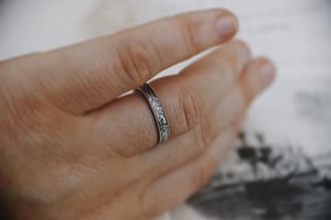 Image of Platinum 3mm flat court laurel leaf and milled edge engraved ring