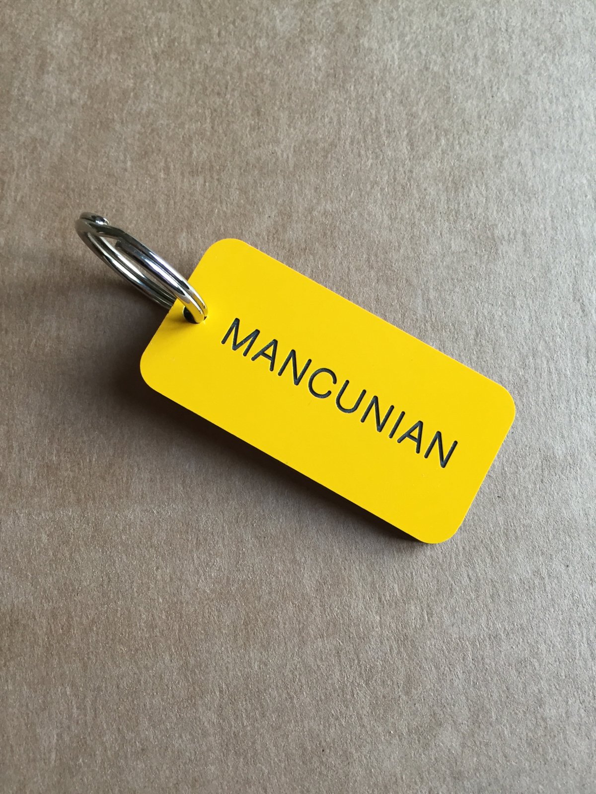 Image of Mancunian Keyring in Yellow + Black
