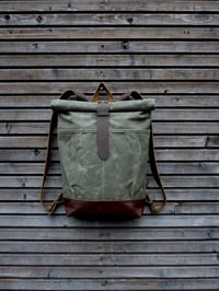 Image 1 of Waxed canvas rucksack / backpack with roll up top and leather shoulder straps and bottom