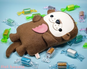 Image of Otter stuffed animal. Cute handmade Sea Otter stuffy doll with removable magnetic heart.