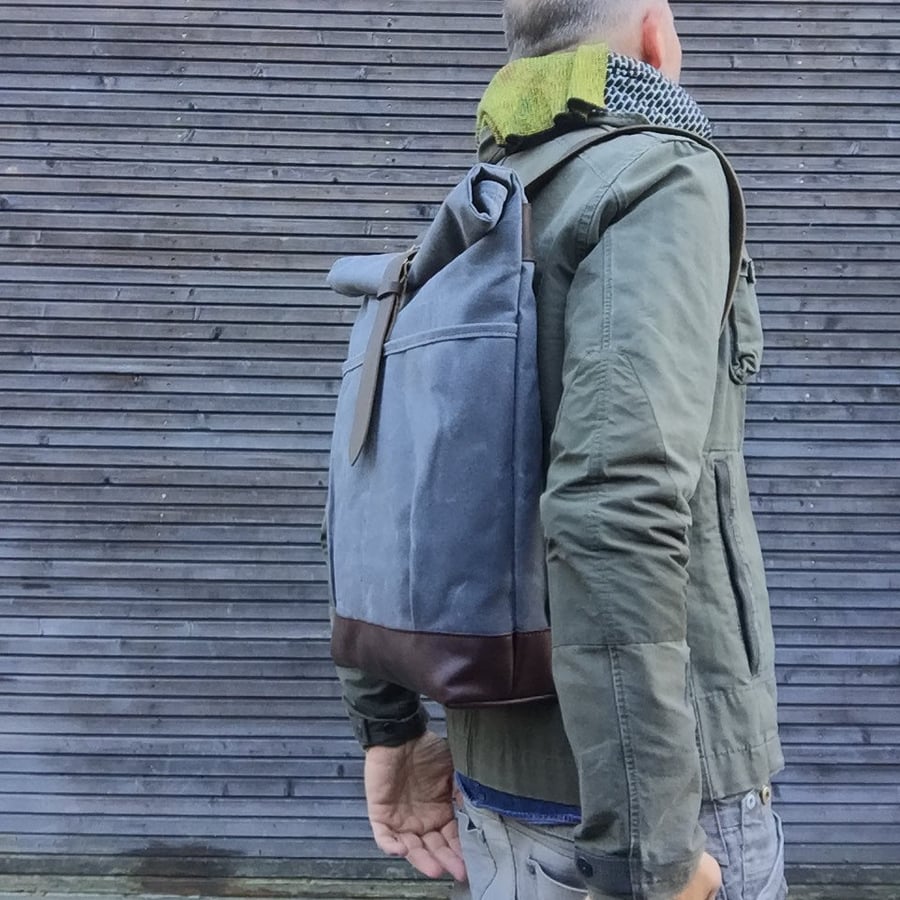 Image of waxed canvas backpack with roll to close top and leather bottom