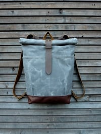 Image 2 of waxed canvas backpack with roll to close top and leather bottom