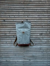 Image 4 of waxed canvas backpack with roll to close top and leather bottom