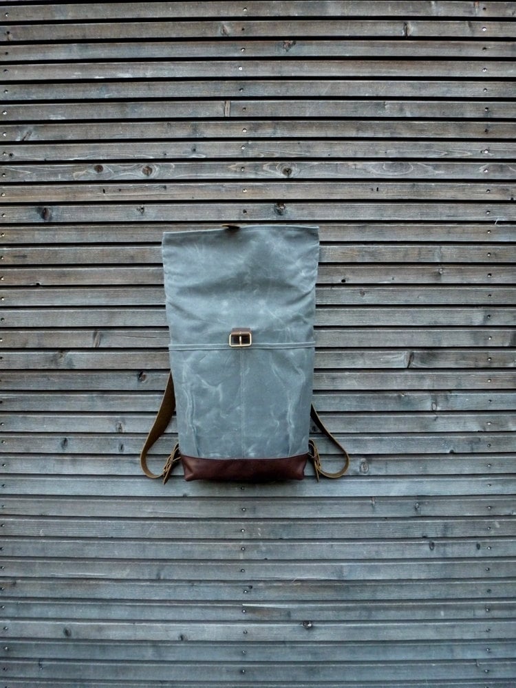 Image of waxed canvas backpack with roll to close top and leather bottom