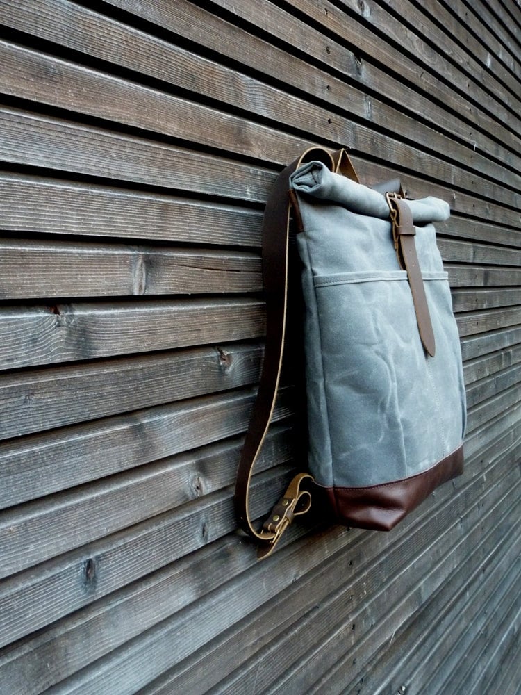 Image of waxed canvas backpack with roll to close top and leather bottom
