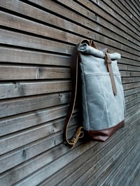 Image 5 of waxed canvas backpack with roll to close top and leather bottom