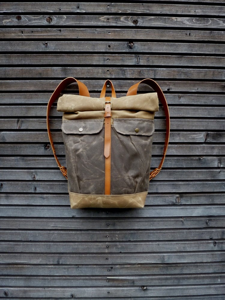 Waxed canvas backpack with roll to close top and leather shoulderstrap ...
