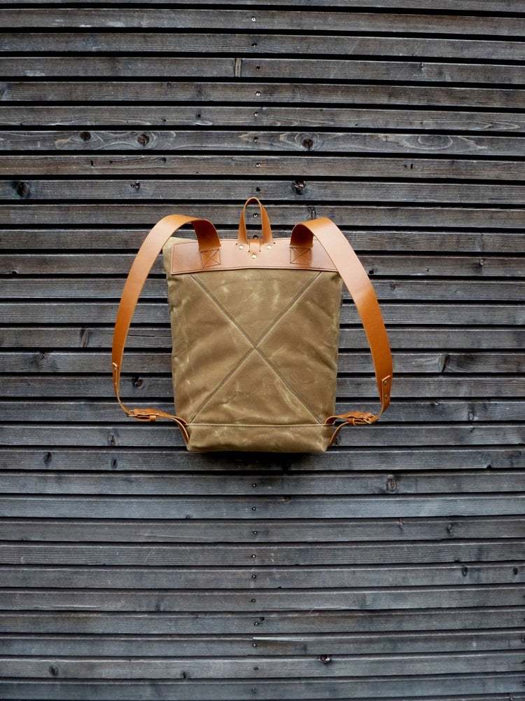 Image of Waxed canvas backpack with roll to close top and leather shoulderstrap and back reinforcement