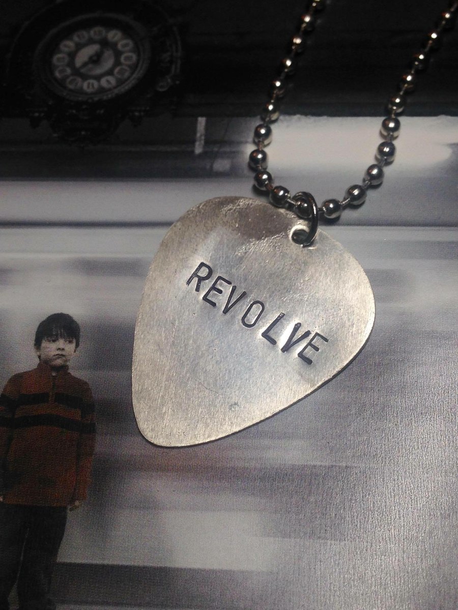 Image of REVOLVE Guitar Pick Necklace