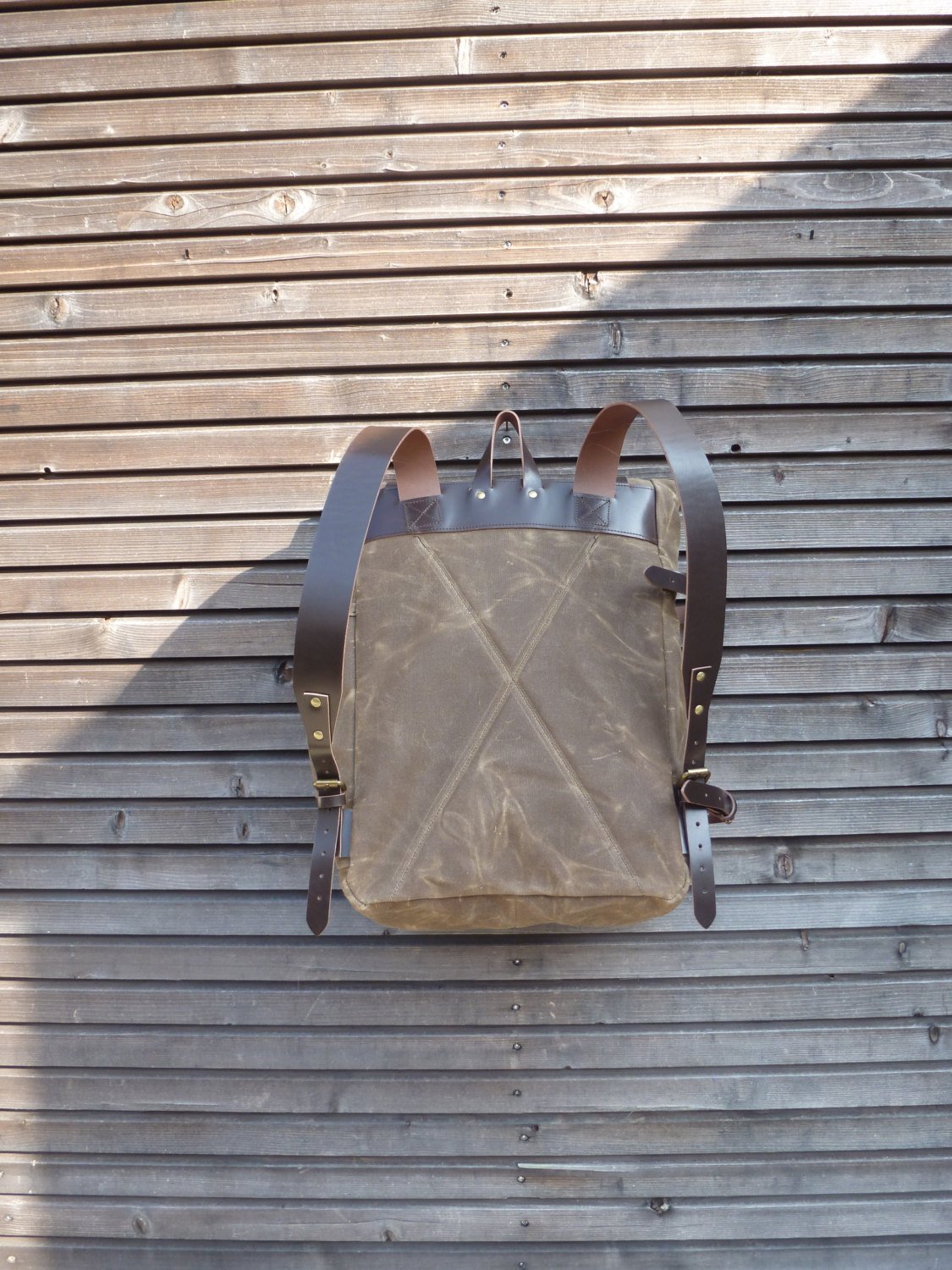 Image of Waxed canvas backpack with bottle pocket and side leather side straps