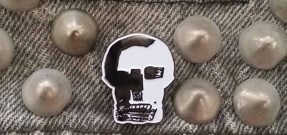 Image of MOTH skull logo enamel pin