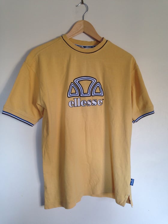 Image of Ellesse vintage tshirt, size small, 1980s design.
