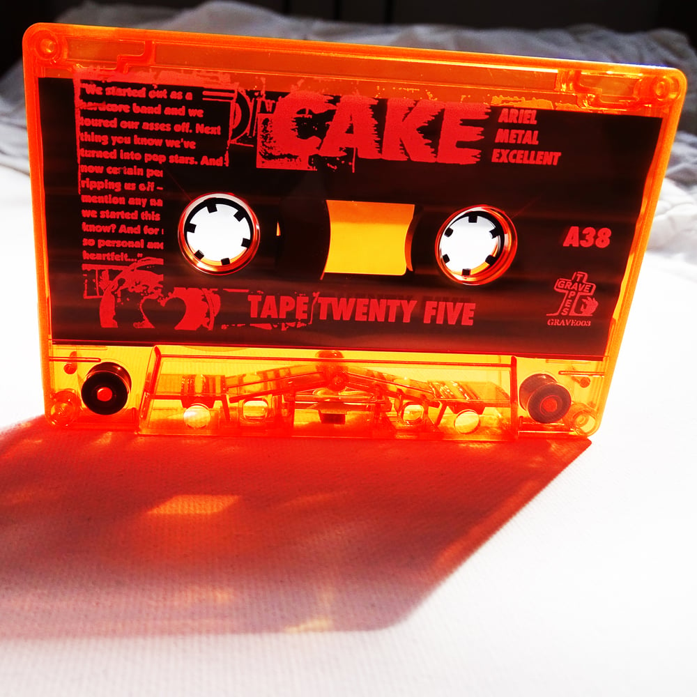 Image of CAKE (UK) - TAPE TWENTY FIVE - Limited Edition Transluscent Orange Cassette - (GRAVE 003)