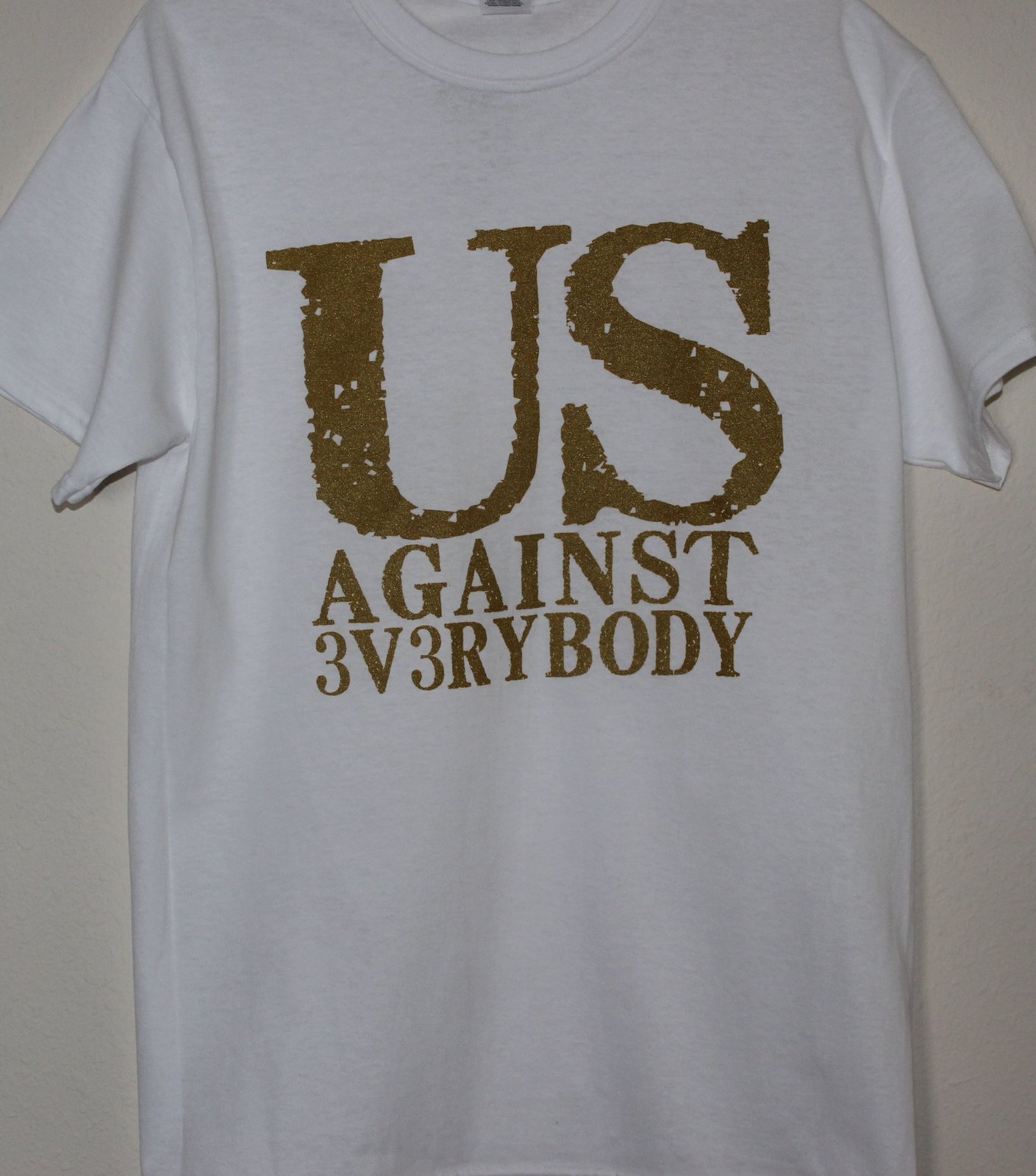 White shirt hot sale gold letters