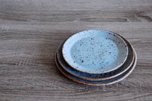 Image of plates, speckled blue