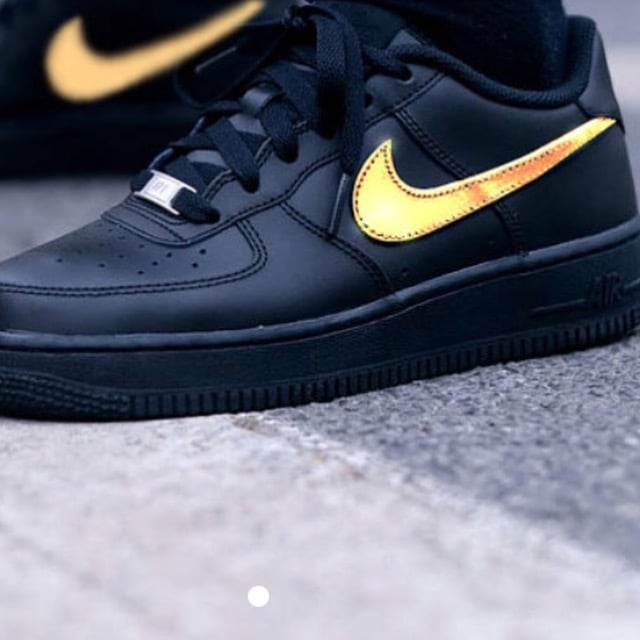 black air forces with gold swoosh